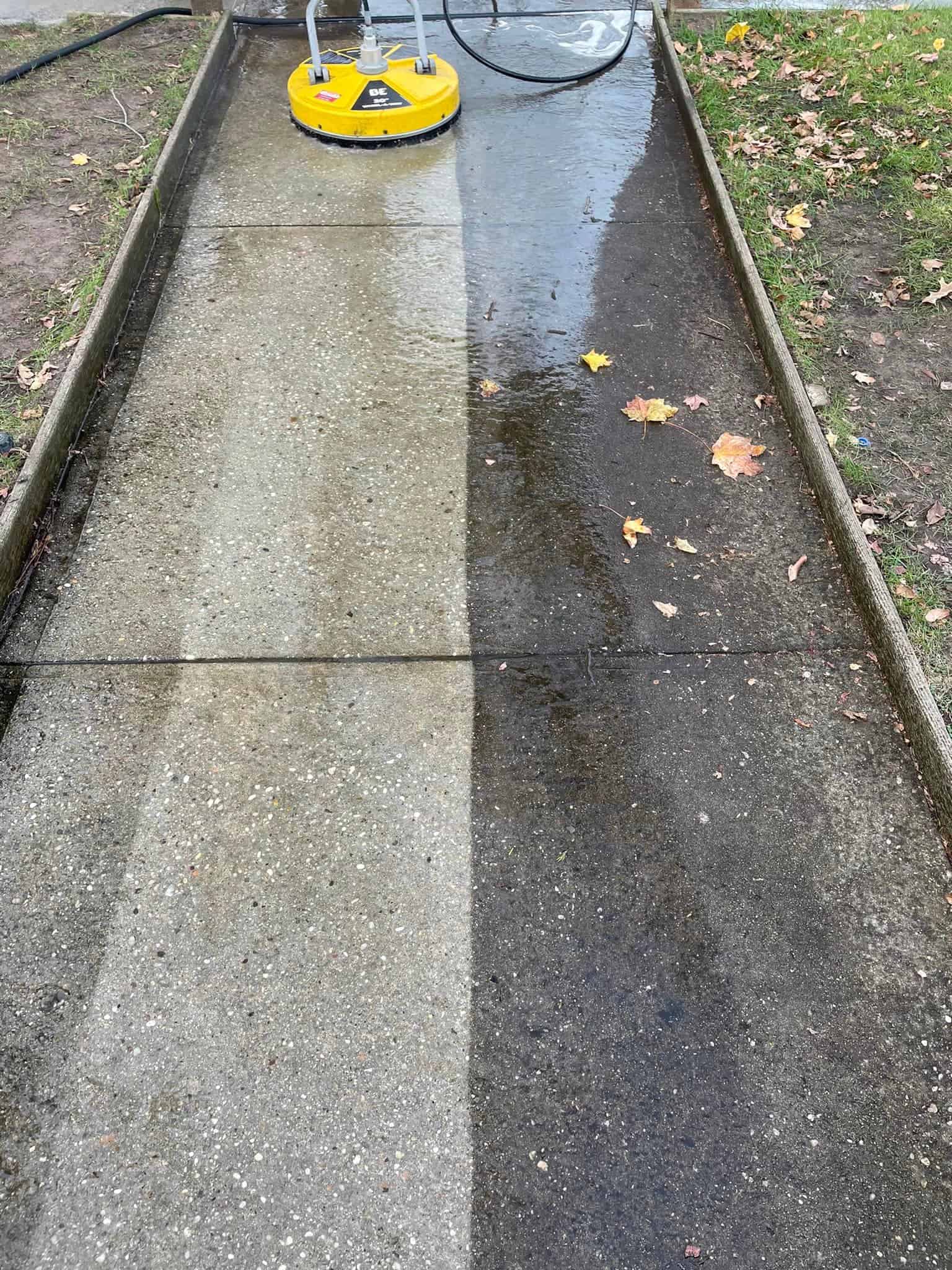 sidewalk being soft washed.